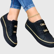 Serena Winthrop | Black Platform Sneakers with Gold Chain Detail