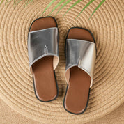 Margolaine Dubreuil | Black Faux Leather Flat Slide Sandals