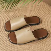 Margolaine Dubreuil | Black Faux Leather Flat Slide Sandals