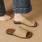 Margolaine Dubreuil | Black Faux Leather Flat Slide Sandals
