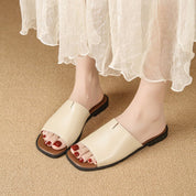 Margolaine Dubreuil | Black Faux Leather Flat Slide Sandals