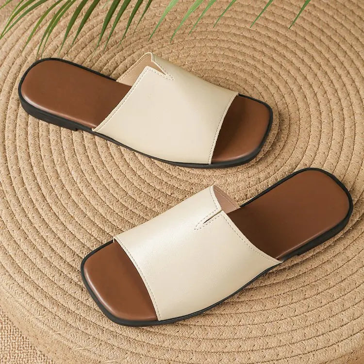 Margolaine Dubreuil | Black Faux Leather Flat Slide Sandals