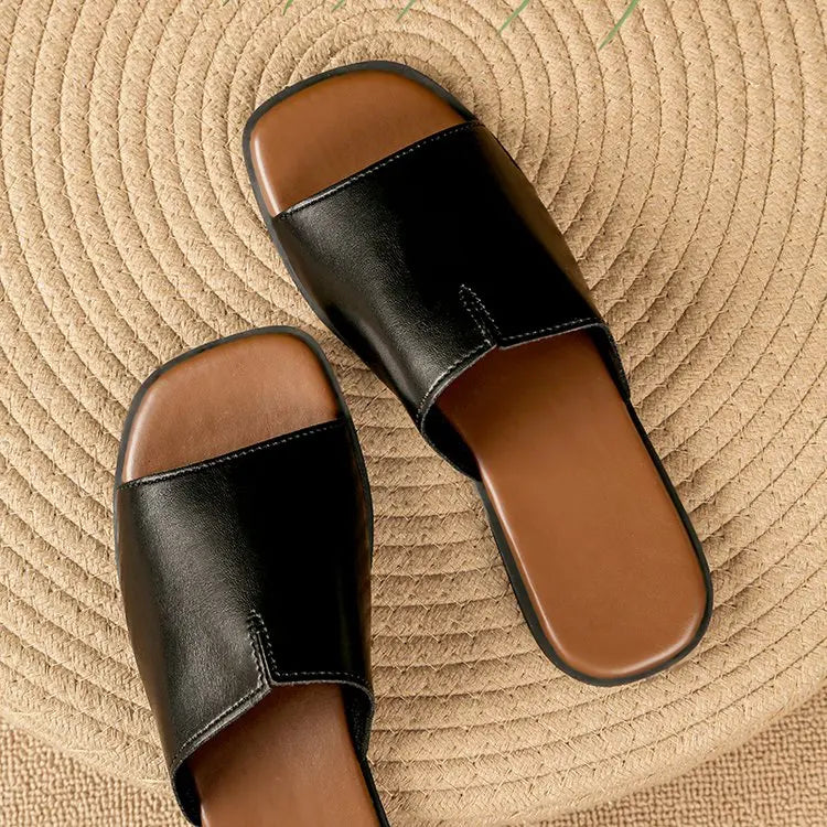 Margolaine Dubreuil | Black Faux Leather Flat Slide Sandals