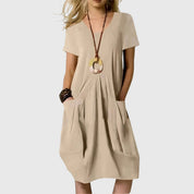 Elaine Rossmore | Orange V-Neck Midi Dress with Pockets